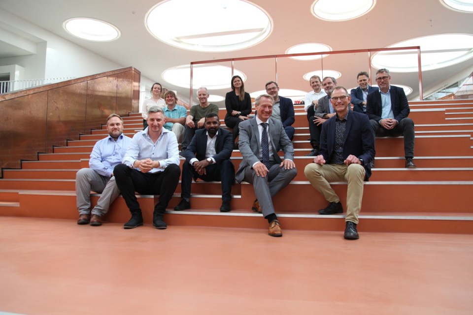 A group of people sitting on stairs