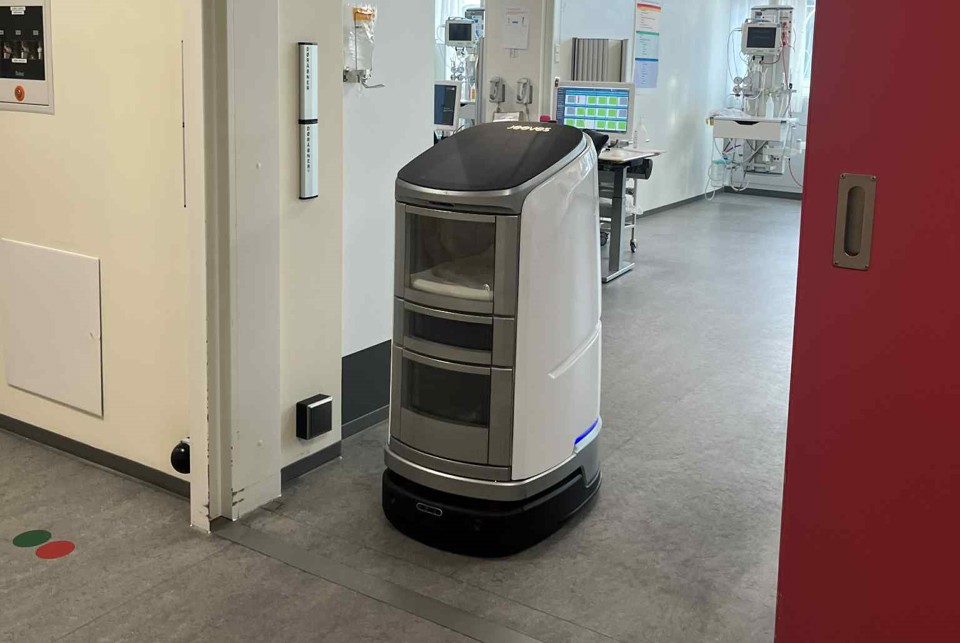The robot Jeeves driving out of a room